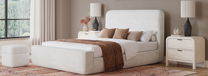 Bright bedroom with a white upholstered platform bed